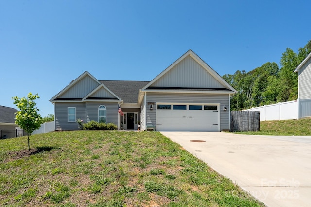 2205 Philadelphia Church Rd, Dallas, NC 28034 - craftsman-style house featuring board and batten siding, driveway, a garage, fence, and a front lawn