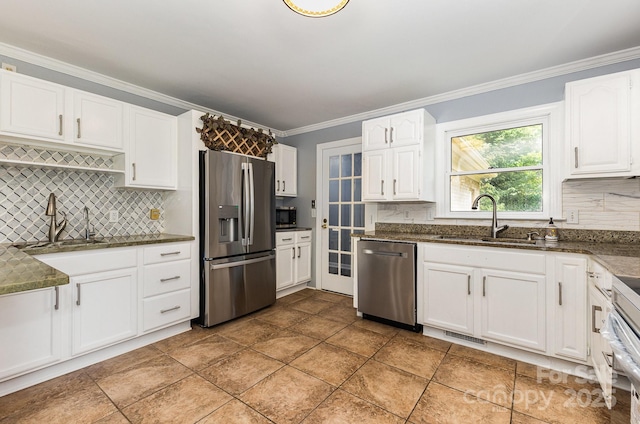 109 Arabian Ln, Salisbury, NC 28147 - kitchen with stainless steel appliances, a sink, decorative backsplash, and crown molding