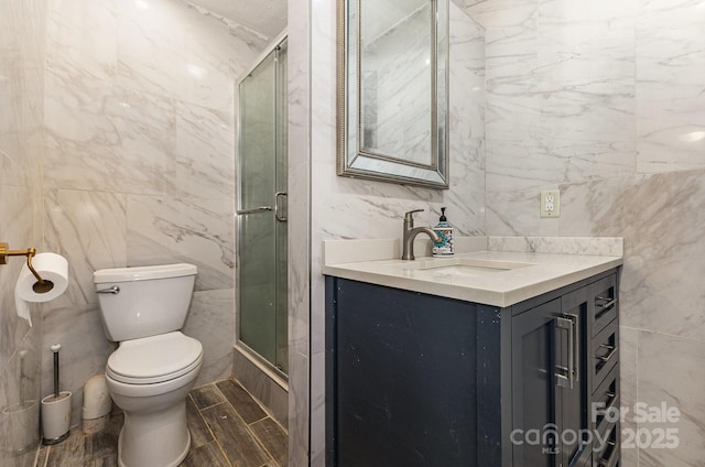 109 Arabian Ln, Salisbury, NC 28147 - bathroom featuring tile walls, vanity, toilet, and enclosed tub / shower combo