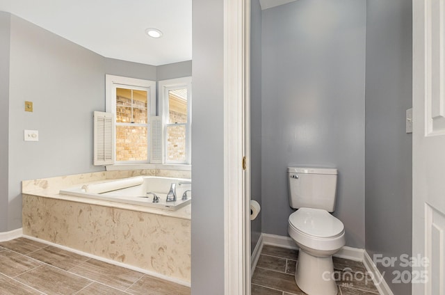109 Arabian Ln, Salisbury, NC 28147 - full bath with a garden tub, toilet, and baseboards