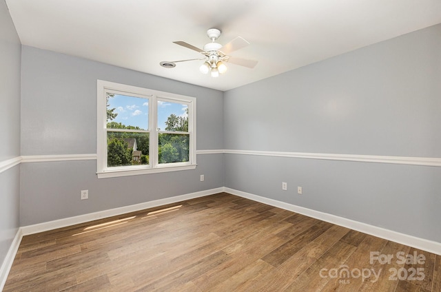 109 Arabian Ln, Salisbury, NC 28147 - empty room featuring wood finished floors, a ceiling fan, and baseboards