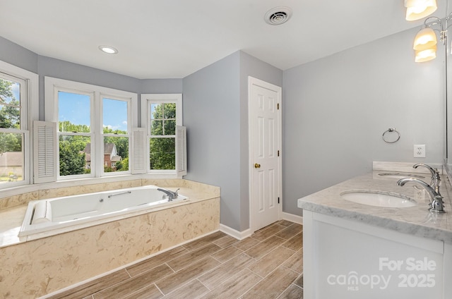 109 Arabian Ln, Salisbury, NC 28147 - full bathroom with a bath, double vanity, baseboards, wood tiled floors, and recessed lighting