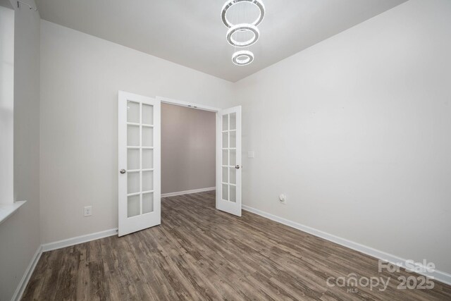150 Falls Cove Dr, Troutman, NC 28166 - empty room with baseboards, french doors, and wood finished floors