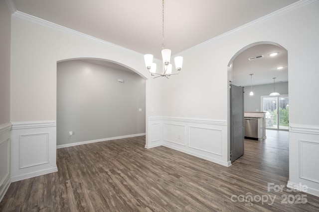 150 Falls Cove Dr, Troutman, NC 28166 - unfurnished room with arched walkways, visible vents, dark wood finished floors, and a wainscoted wall
