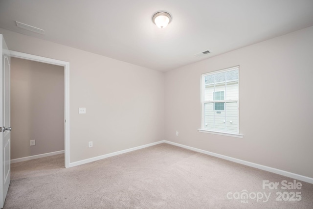 150 Falls Cove Dr, Troutman, NC 28166 - spare room featuring carpet flooring, baseboards, and visible vents