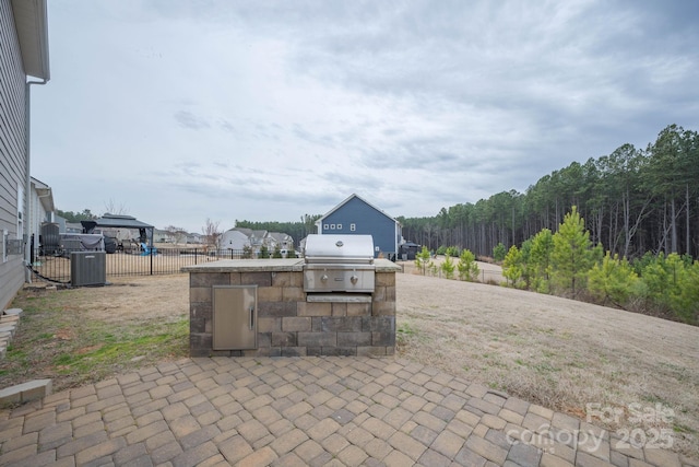 150 Falls Cove Dr, Troutman, NC 28166 - view of patio / terrace with exterior kitchen, grilling area, and fence