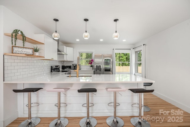 6301 Vernedale Rd, Charlotte, NC 28212 - kitchen with appliances with stainless steel finishes, open shelves, a sink, a peninsula, and light countertops
