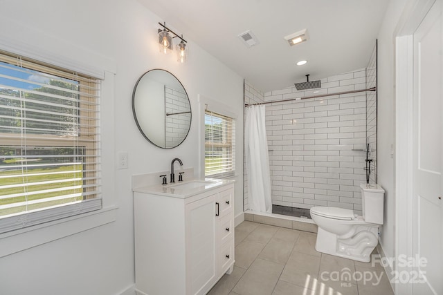 6301 Vernedale Rd, Charlotte, NC 28212 - full bath with tile patterned floors, a stall shower, vanity, and toilet