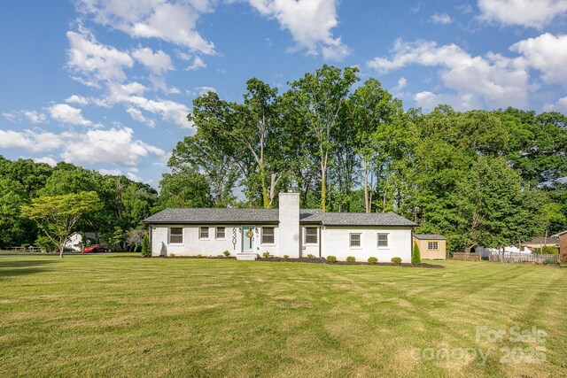 6301 Vernedale Rd, Charlotte, NC 28212 - view of front of house with a front lawn, a chimney, and view of scattered trees