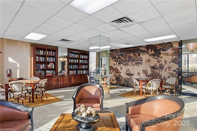 1101 N Elm St Unit 603, Greensboro, NC 27401 - living room with visible vents and a paneled ceiling