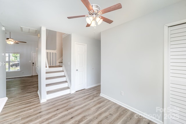unfurnished bedroom featuring light wood-style floors, baseboards, ceiling fan, and visible vents