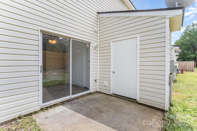 doorway to property with a patio