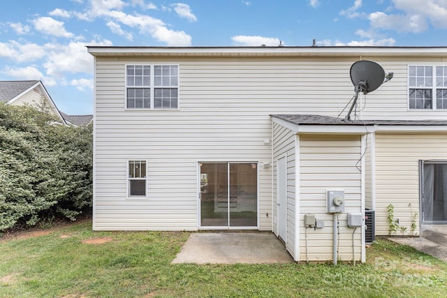 back of house featuring a yard and a patio