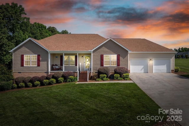 6084 Little River Ct, Granite Falls, NC 28630 - view of front facade with an attached garage, covered porch, concrete driveway, and a front lawn
