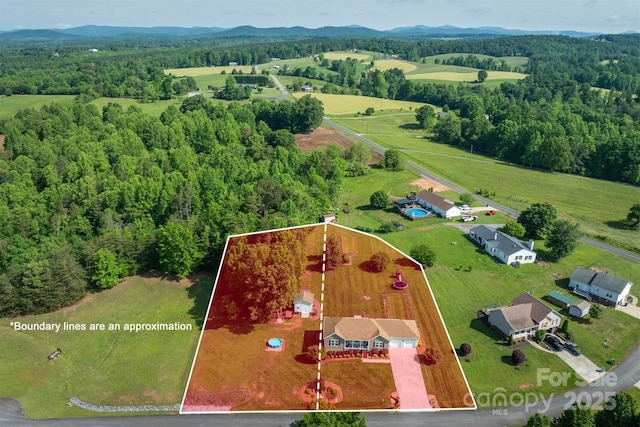 6084 Little River Ct, Granite Falls, NC 28630 - view of rural area with property parcel outlined, a forest, and a mountainous background