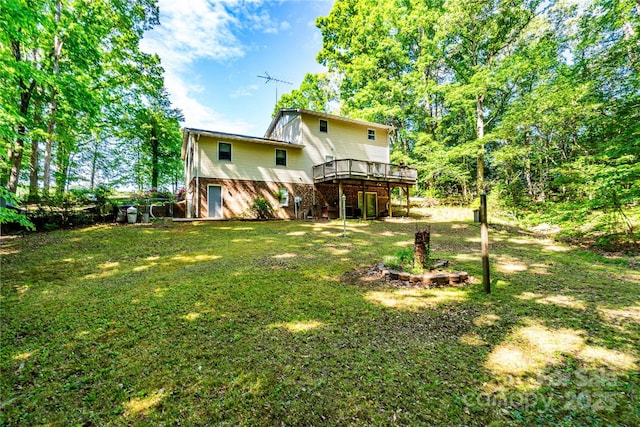 view of yard featuring a wooden deck
