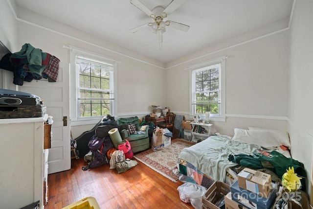 bedroom featuring ceiling fan and wood finished floors