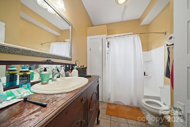 full bathroom with tile patterned flooring, vaulted ceiling, shower / bath combo with shower curtain, toilet, and vanity