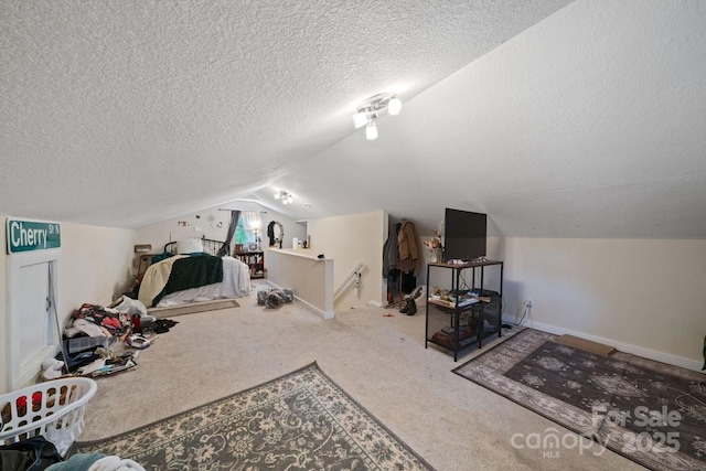 bonus room with lofted ceiling, a textured ceiling, baseboards, and carpet floors