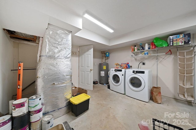 laundry area featuring laundry area, washer and clothes dryer, and electric water heater