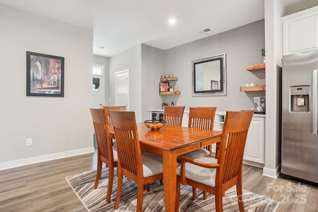 dining space featuring visible vents, recessed lighting, baseboards, and light wood-type flooring