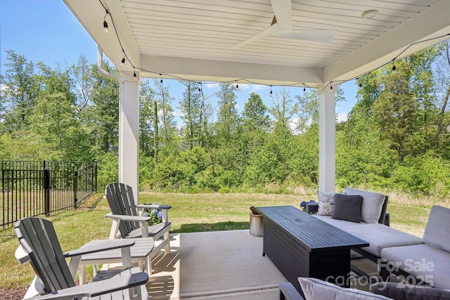 view of patio / terrace featuring an outdoor living space and fence