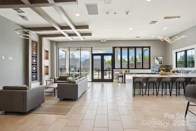 building lobby with visible vents and a sink