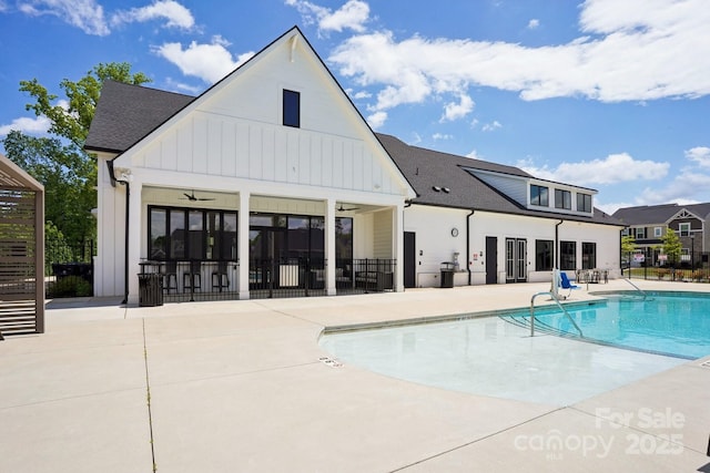 pool with a patio, fence, and a ceiling fan