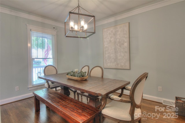 3009 Thayer Dr, Waxhaw, NC 28173 - dining area with wood finished floors, a chandelier, baseboards, and ornamental molding