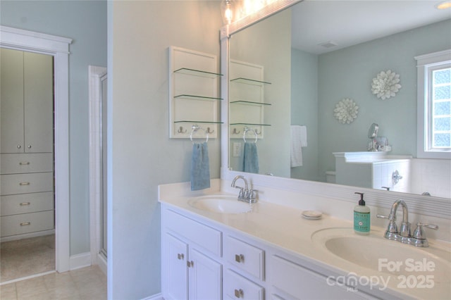3009 Thayer Dr, Waxhaw, NC 28173 - full bath featuring tile patterned flooring, a shower stall, double vanity, and baseboards