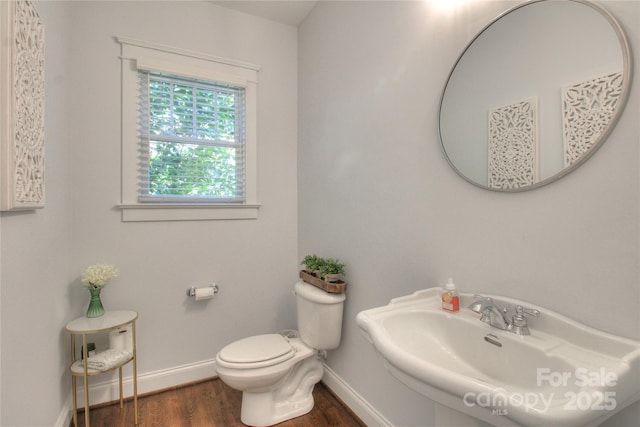 3009 Thayer Dr, Waxhaw, NC 28173 - half bathroom featuring a sink, wood finished floors, baseboards, and toilet