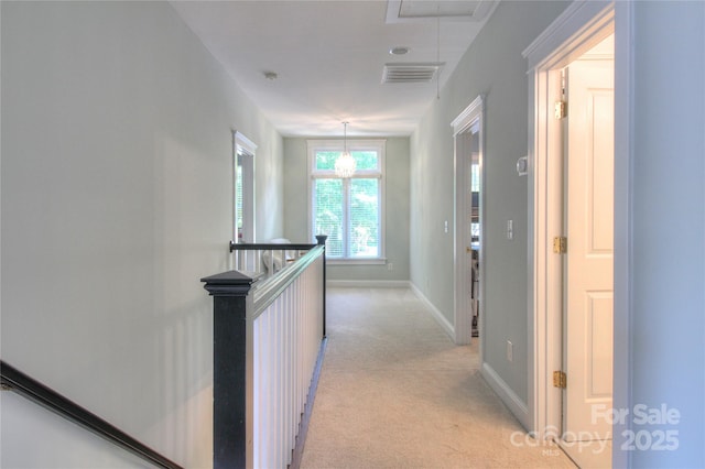 3009 Thayer Dr, Waxhaw, NC 28173 - corridor with an upstairs landing, attic access, light colored carpet, and baseboards
