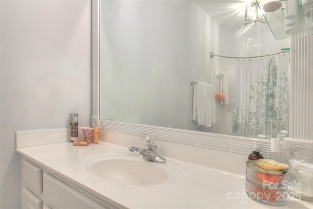 3009 Thayer Dr, Waxhaw, NC 28173 - bathroom featuring vanity, curtained shower, and a chandelier