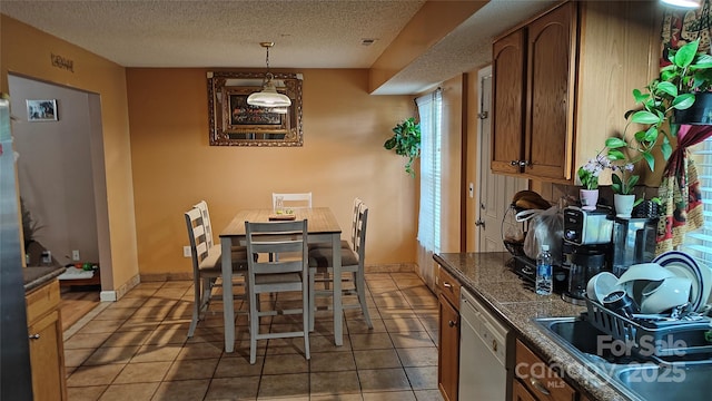8524 Stoneman Pl, Charlotte, NC 28217 - tiled dining space with baseboards and a textured ceiling