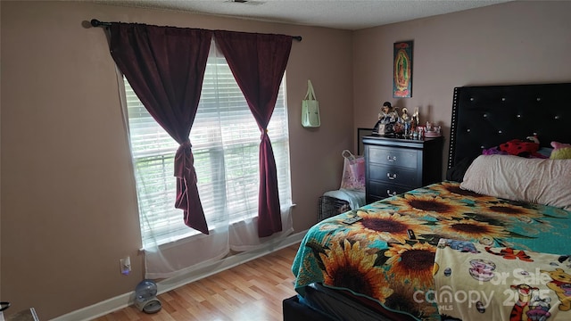 8524 Stoneman Pl, Charlotte, NC 28217 - bedroom featuring baseboards, visible vents, and light wood-style floors