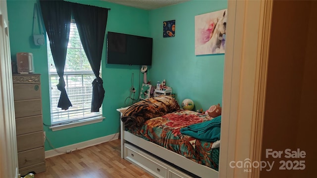 8524 Stoneman Pl, Charlotte, NC 28217 - bedroom featuring light wood-style floors and baseboards