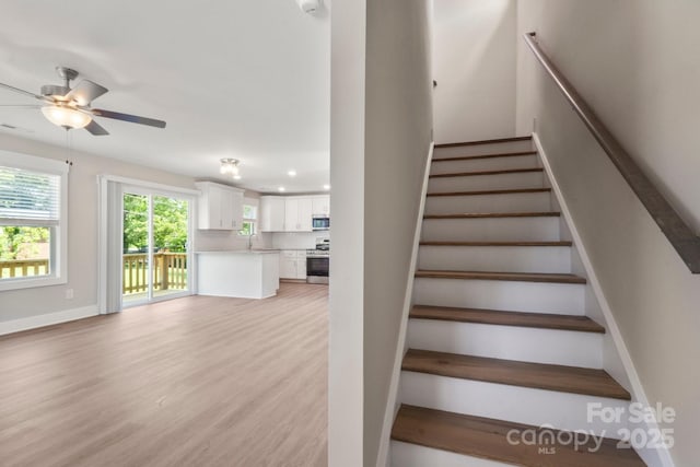 236 Elizabeth Ave, Forest City, NC 28043 - stairs with baseboards, recessed lighting, ceiling fan, and wood finished floors