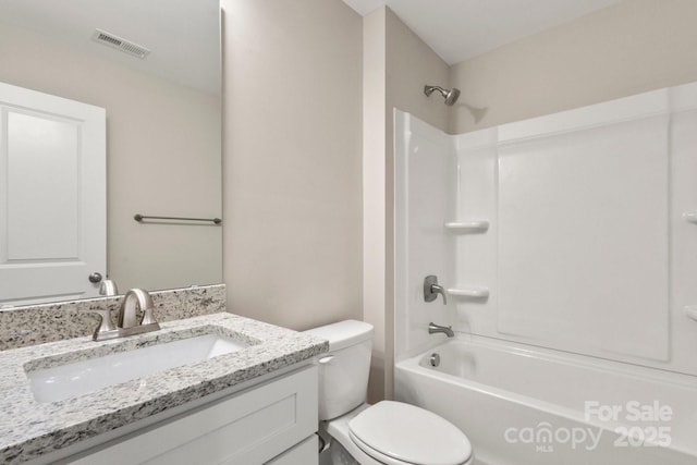 236 Elizabeth Ave, Forest City, NC 28043 - bathroom with visible vents, shower / bathing tub combination, toilet, and vanity