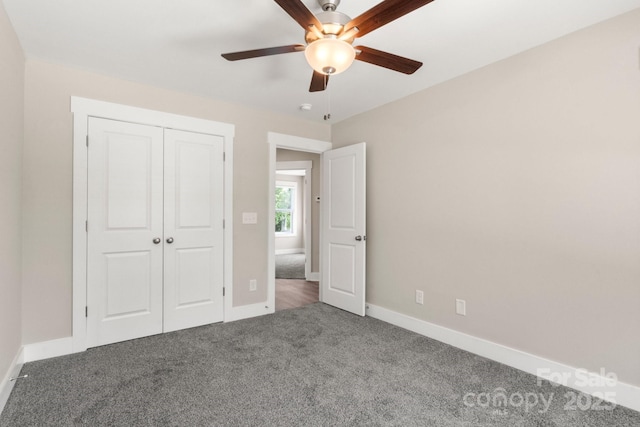 236 Elizabeth Ave, Forest City, NC 28043 - unfurnished bedroom with a closet, baseboards, ceiling fan, and carpet flooring