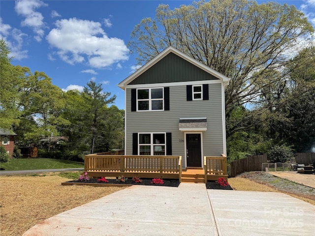 236 Elizabeth Ave, Forest City, NC 28043 - view of front of property featuring fence, a wooden deck, and a front yard