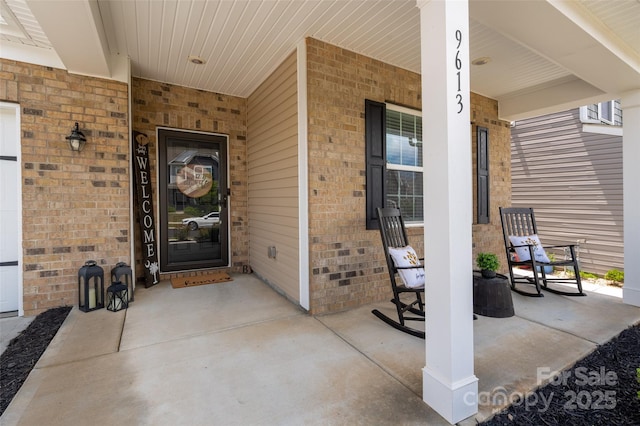 9613 Fire Bellied Ct, Lancaster, SC 29720 - property entrance with covered porch and brick siding