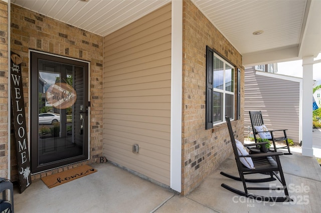 9613 Fire Bellied Ct, Lancaster, SC 29720 - property entrance with covered porch and brick siding