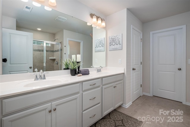 9613 Fire Bellied Ct, Lancaster, SC 29720 - full bath with double vanity, a stall shower, and tile patterned flooring