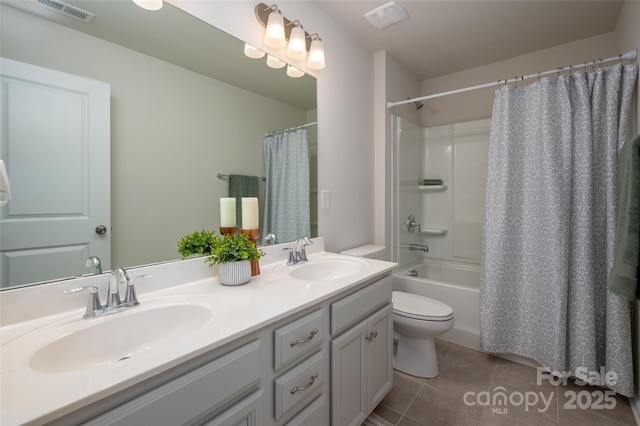 9613 Fire Bellied Ct, Lancaster, SC 29720 - full bath featuring toilet, tile patterned floors, double vanity, and shower / bath combo
