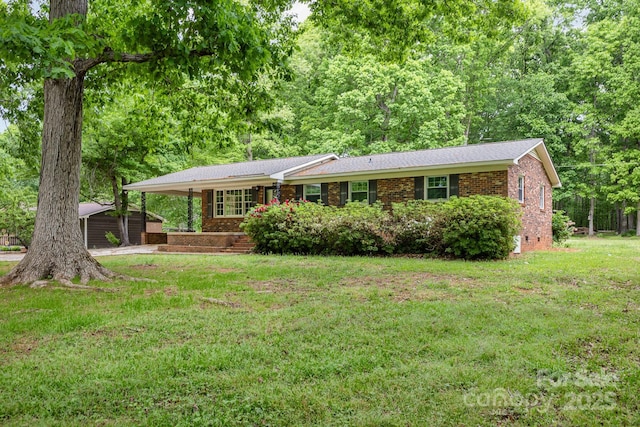 ranch-style house with brick siding and a front lawn