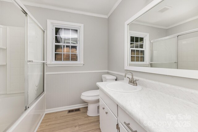 full bathroom with visible vents, wood finished floors, toilet, and vanity