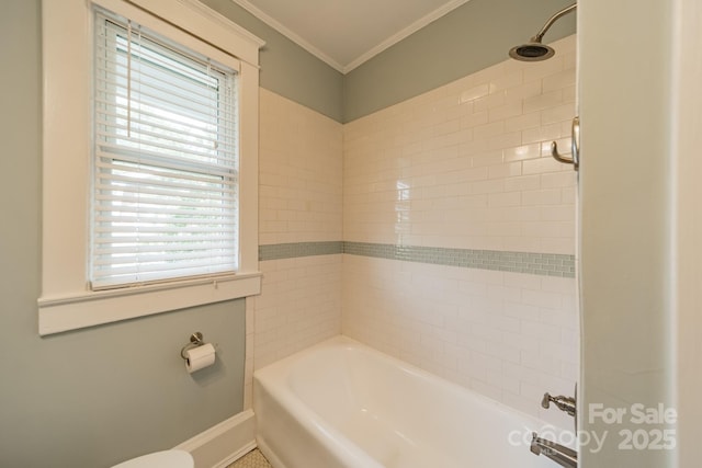 bathroom with crown molding and baseboards