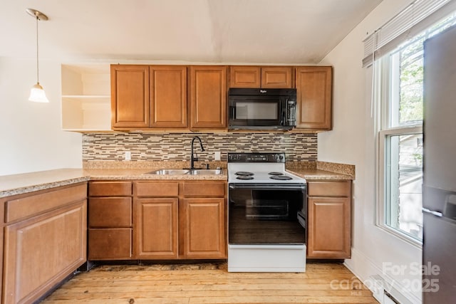 kitchen with electric range, open shelves, black microwave, a sink, and light wood-style flooring