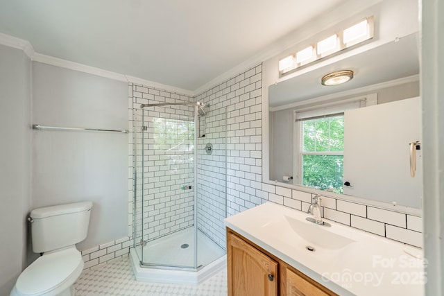 bathroom featuring crown molding, toilet, and a shower stall