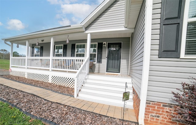 property entrance with a porch